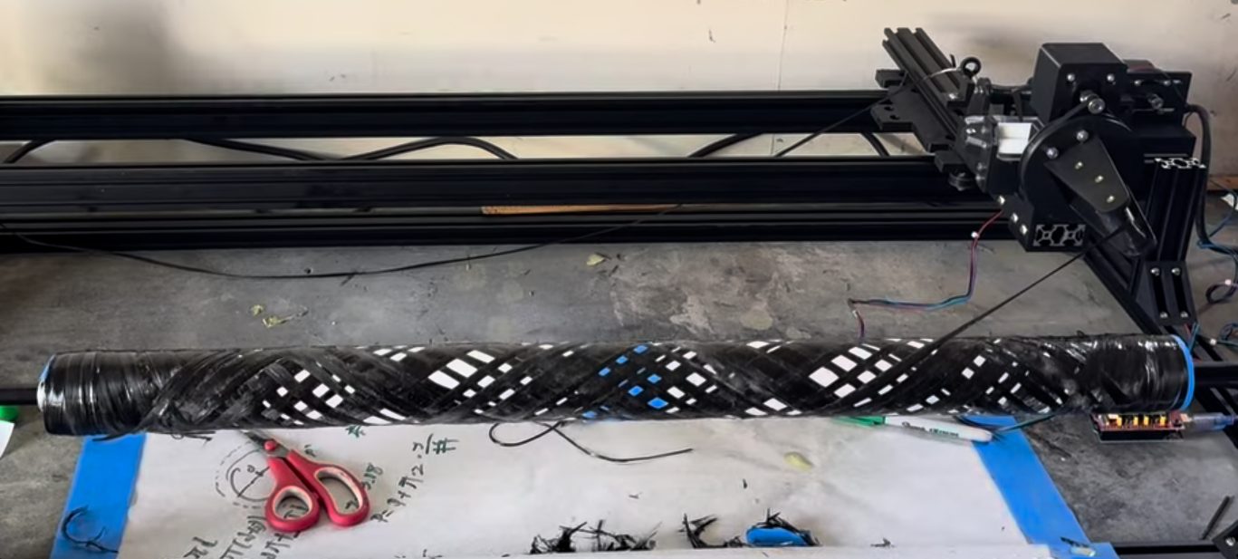 Winding carbon fiber tow onto a mandrel